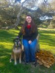 Kelsey and Kona seated outdoor portrait